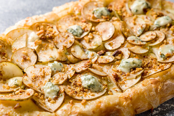 pizza with pear and Gorgonzola on Roman dough, pinsa macro close up