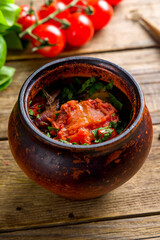chanakhi Georgian Cuisine on old wooden table vertical
