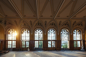 Large hall of abandoned building in gothic style