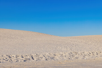 Sunny view of the landscape with some footprints in White Sands National Park
