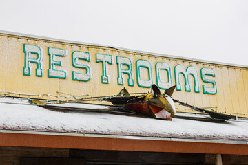 Close up shot of restroom shop sign near Carlsbad Caverns NP