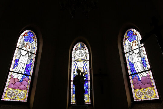 Stained glass with angel theme and Holy Spirit