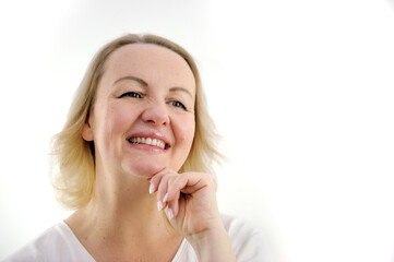 Fototapeta premium Portrait of happy woman smiling and standing isolated on white background girl with perfect smile looking right Beautiful female smile after teeth whitening procedure. Dental care. Dentistry concept.