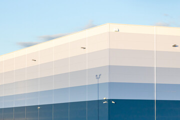 Close-up of an industrial building against the blue sky