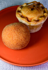 Traditional street food in UK, stuffed fried Scotch eggs with breadcrumbs and baked pie with pork meat