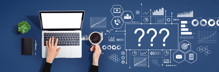Question marks with person using a laptop computer