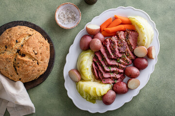 Corned beef with cabbage and potatoes on a serving platter - obrazy, fototapety, plakaty