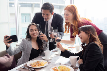 Happy team young business people in party celebrate success selfie taking a photo with friends together at restaurant, friendship and social colleague, meet friends and community concept.