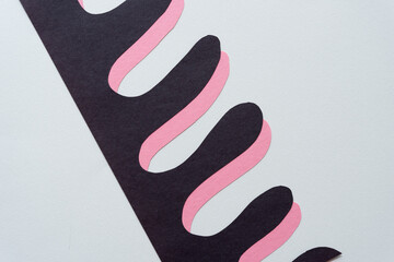 black on pink cut paper shapes (polyp, columnar, organic, or finger) on blank paper