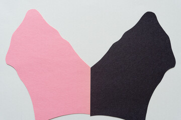 retro modern pink and black paper shapes arranged on blank paper