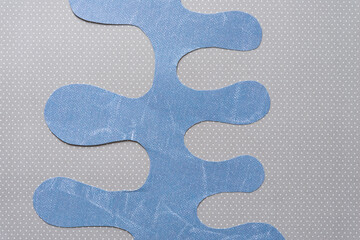 cut scrapbook paper with polyp or columnar edges on dotted paper background