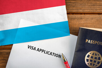 Fototapeta na wymiar Visa application form, passport and flag of Luxembourg 