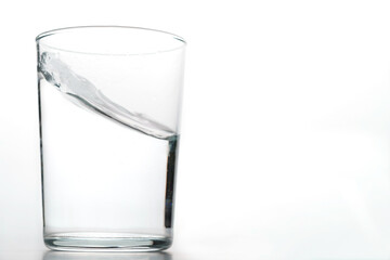 glass of crystal clear water in motion