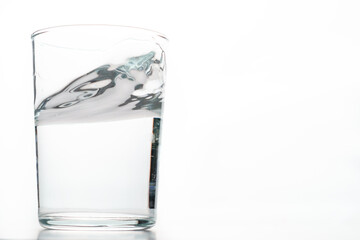 glass of crystal clear water in motion