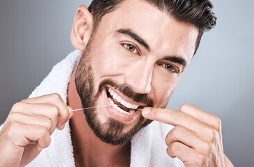 Mouth floss, tooth and man in studio for wellness, healthy body care or hygiene on background....
