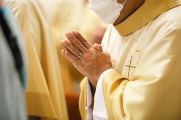 Praying hands priest portrait of male