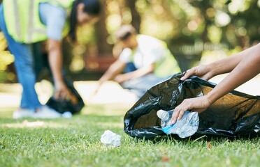 Volunteer hands, cleaning up and trash bag for pollution, carbon footprint and eco friendly in...