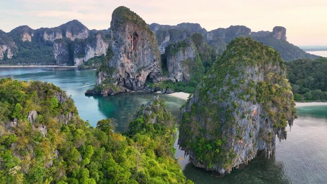 Aerial view of iconic tropical Railay beach in Thailand, beautiful limestone cliffs of idyllic Thailand Ao Nang beach. Paradise Krabi resort with scenic rock formation. Thai holiday destination
