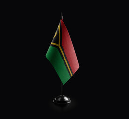 Fototapeta premium Small national flag of the Vanuatu on a black background