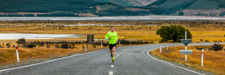 Fototapeta premium Runner man running on road in autumn banner