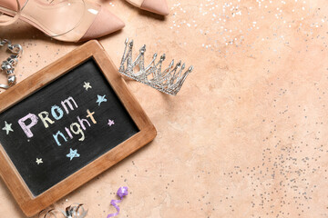 Chalkboard with text PROM NIGHT, tiara, heels and serpentine on beige background © Pixel-Shot