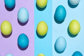 Composition with Easter eggs on color background