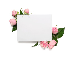 Composition with blank card and beautiful rose flowers on white background