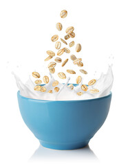 oatmeal falling in blue bowl with splashing milk isolated on white