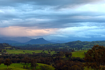 Fototapeta na wymiar Australian Farm Landscape with Mountains in the Background