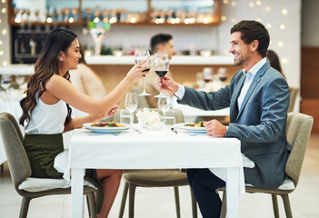 Love, wine and couple toast in restaurant for romantic dinner, honeymoon and anniversary...