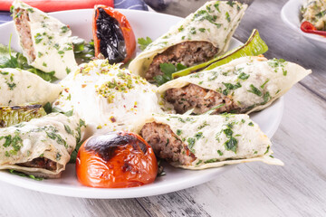 Turkish Beyti Kebap or kebab with grilled vegetables