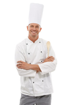 Portrait of chef, wooden spoon and confident smile, cafe owner isolated on white background. Happy executive cook, uniform, cooking for restaurant discount deal, menu special or promotion in studio.