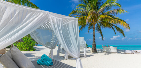 Relax on luxury VIP beach with white pavilions in sunny blue sky. Luxury vacation beach holiday in tropical resort, hotel. Couple retreat Fantastic leisure lifestyle landscape, palm trees white sand