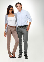 Couple, love and people standing together looking happy, confident and excited isolated in studio white background. Portrait, man and woman in a relationship in happiness feeling content