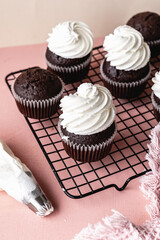 chocolate cake with chocolate muffin cupcake with butter cream and syrup and whipped cream