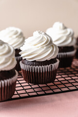chocolate cake with chocolate muffin cupcake with butter cream and syrup and whipped cream