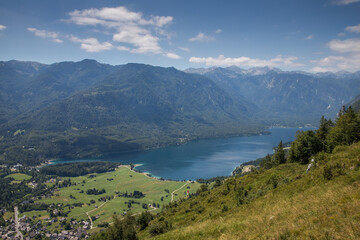 Summer at Lake Bohinj in the Julian Alps - view of the lake, surrounded by mountains