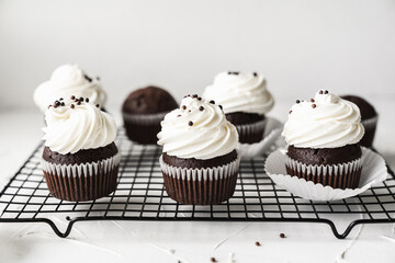 chocolate cake with chocolate muffin cupcake with butter cream and syrup and whipped cream