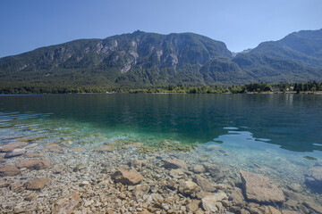 Naklejka na ściany i meble Summer at Lake Bohinj in the Julian Alps - clear water with a rocky bottom