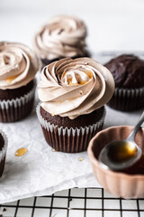 chocolate cake with chocolate muffin cupcake with butter cream and syrup and whipped cream