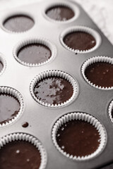 chocolate cake with chocolate muffin cupcake with butter cream and syrup and whipped cream