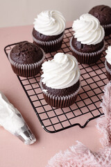 chocolate cake with chocolate muffin cupcake with butter cream and syrup and whipped cream