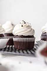 chocolate cake with chocolate muffin cupcake with butter cream and syrup and whipped cream