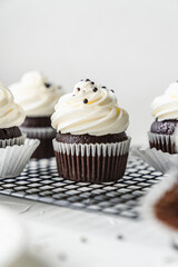 chocolate cake with chocolate muffin cupcake with butter cream and syrup and whipped cream