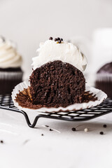 chocolate cake with chocolate muffin cupcake with butter cream and syrup and whipped cream