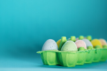 easter eggs painted multi-colored in a box,easter holiday