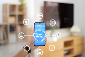 Hand man holding smartphone with smart home system control, Smart home concept