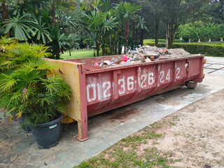 MELAKA, MALAYSIA -MAY 3, 2022: Huge wasted disposal bin used to collect rubbish and unused...