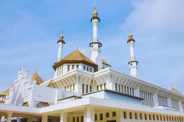  Grand white mosque with golden domes, blue sky background, Tasikmalaya, West Java, Indonesia