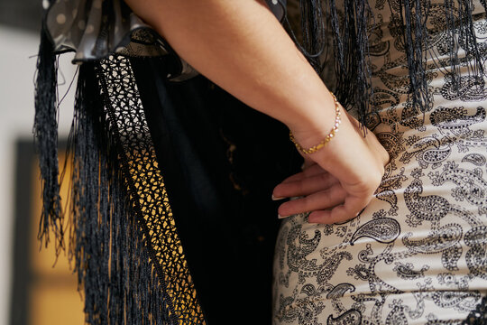 flamenco dancer with her flounced dress. detail